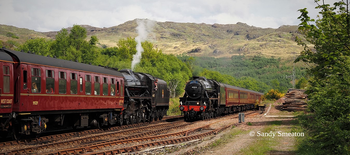 14.10 from Mallaig behind 44871 crossing the 12.50 from Fort William at Arisaig, May 2023
